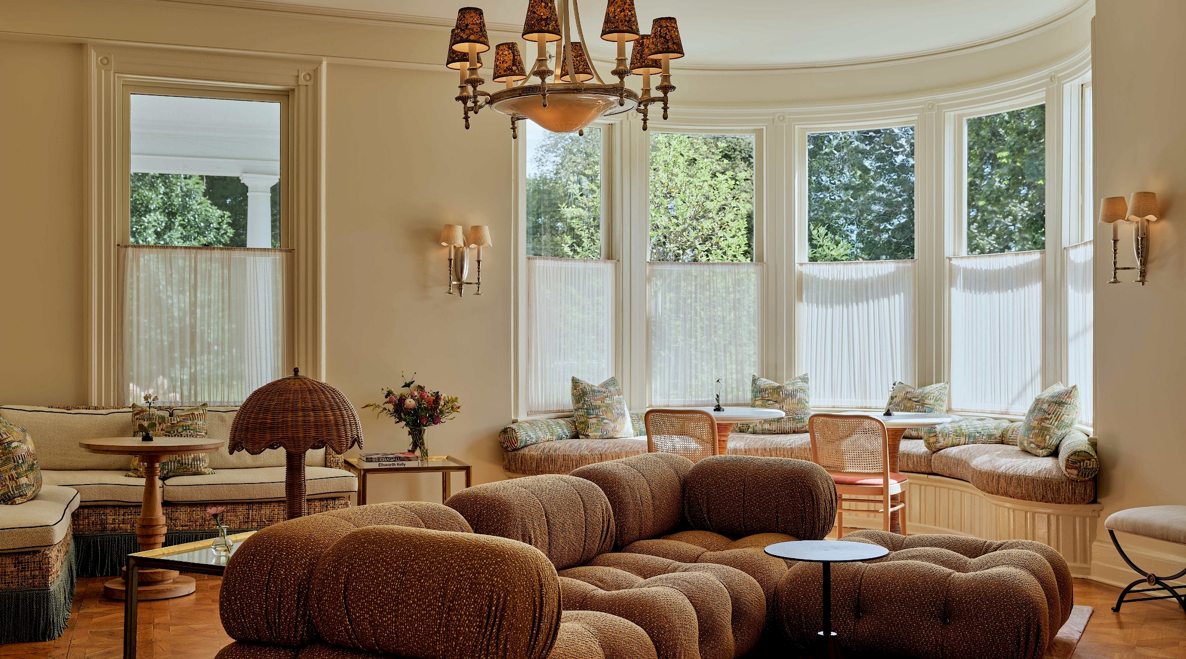 A lush dining room with fireplace and cozy seating